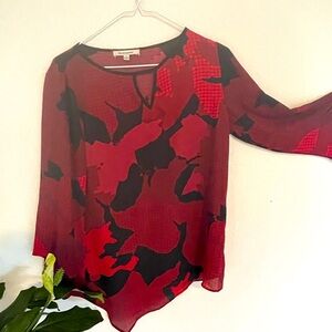 Maroon geometric design blouse.